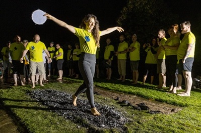 women walking across fire